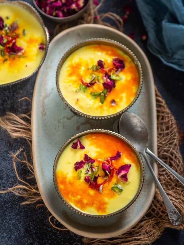 Rabdi (Rabri) is a popular North Indian dessert made by reducing milk and flavoring it with saffron and rose water (or cardamom). Make it in a traditional way using my easy recipe (vegetarian, gluten-free).