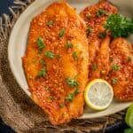 Spicy Baked Basa With Lemon And Garlic is a 30 minutes quick dinner made with Basa fish fillets and a few other simple ingredients. It's low-carb, keto-friendly and bursting with flavors.