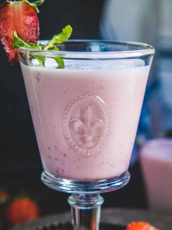 This refreshing strThis refreshing Strawberry Lassi is a delicious take on the classic Indian lassi (a refreshing yogurt drink). Make it in under 5 minutes using 5 ingredients (vegetarian, gluten-free).wberry lassi is a delicious take on the classic Indian lassi (a beverage made using yogurt). Make it in under 5 minutes using 4 ingredients.