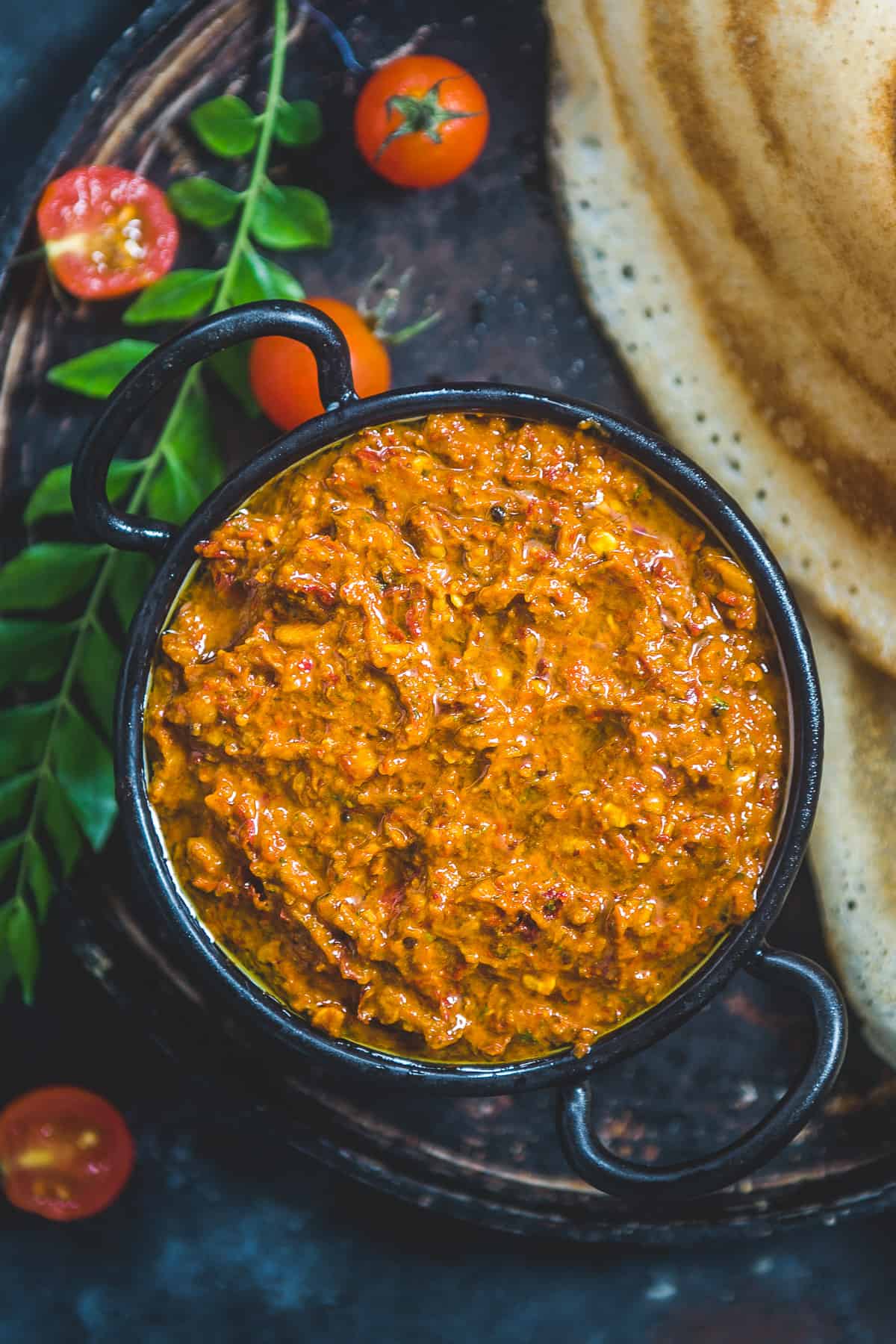 Tomato pachadi served in a bowl.