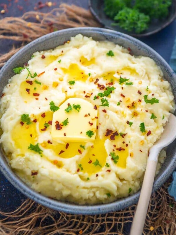 Make these super creamy Instant Pot Garlic Mashed Potatoes in under 50 minutes. This recipe is one pot with no drain, and the potatoes are melt-in-your-mouth soft and fluffy (vegetarian, gluten-free).