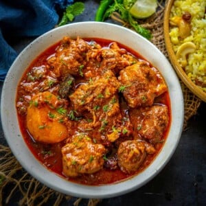 Bengali Kosha Mangsho or Mutton Kasha is a delicious spicy Bengali Mutton Curry that is full of flavors from mutton, spices, and mustard oil. Here is how to make it.