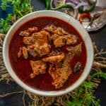 Mutton Rogan Josh is a traditional Kashmiri-style mutton curry flavored with fennel seeds and dry ginger powder. Learn to make it in an authentic way using my easy recipe.