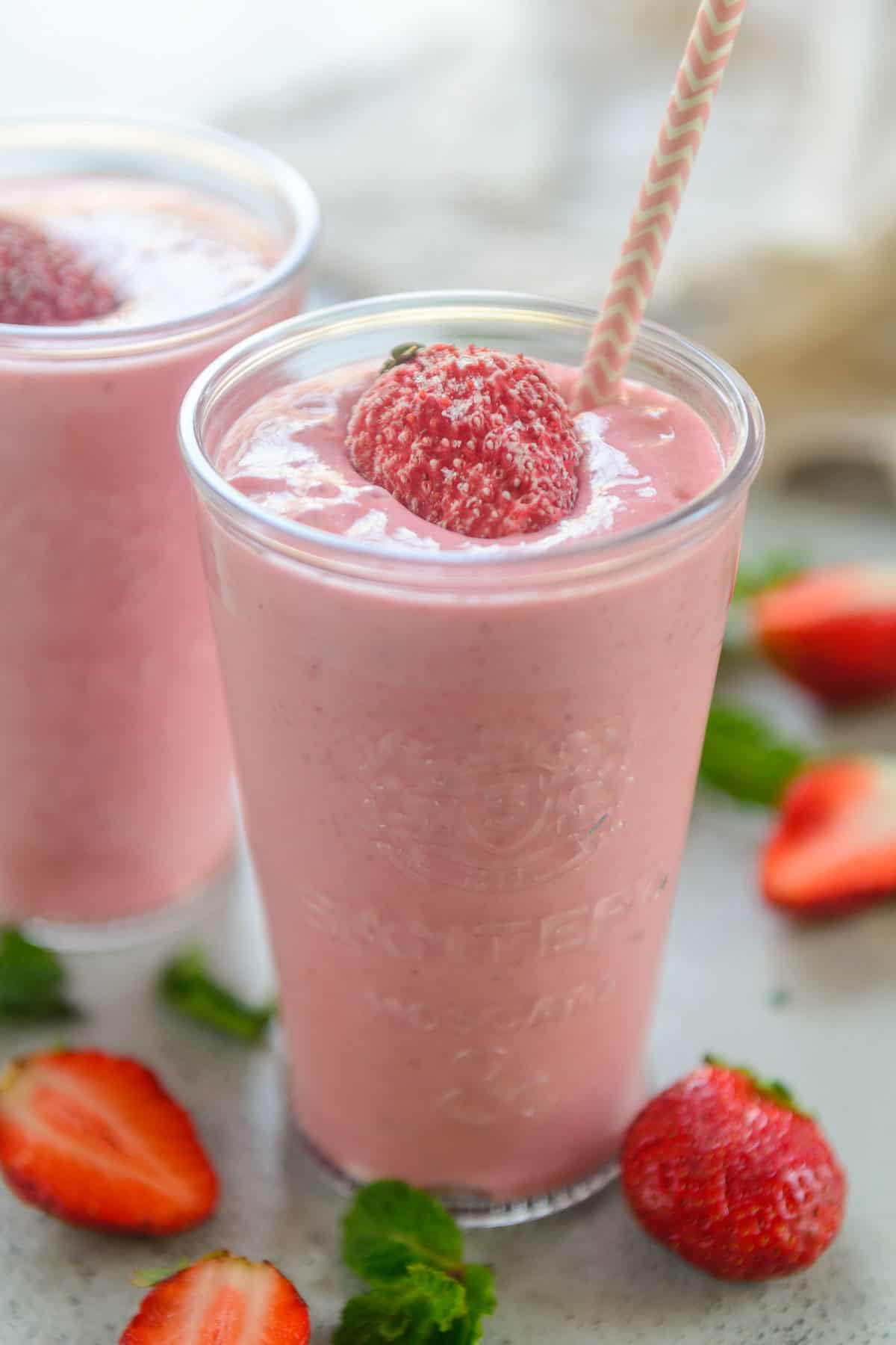 Strawberry banana yogurt smoothie served in a glass.