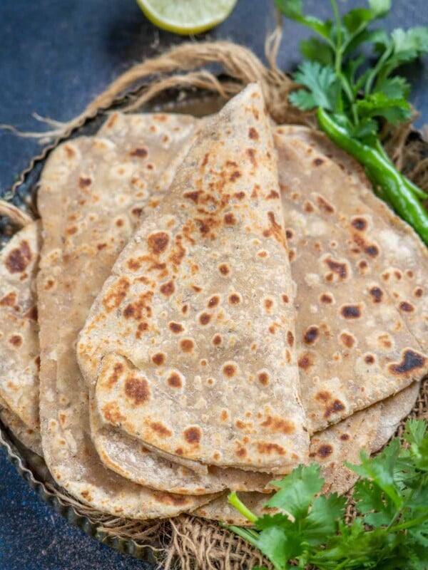 Ajwain Paratha (Carom Seeds Flatbread) is an unleavened Indian flatbread prepared with whole wheat flour, carom seeds (ajwain), salt, and ghee. It is best served for breakfast with tea or coffee.