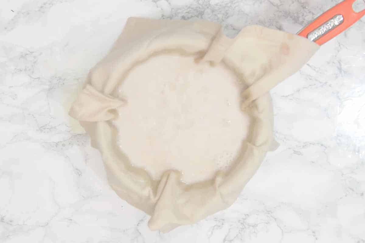 Mixture strained through a fine mesh strainer or muslin cloth.