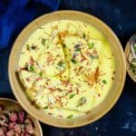 Shahi Tukda (Shahi Toast) is a Mughlai dessert made using deep-fried bread slices, reduced saffron flavored milk (rabdi), and sugar syrup. It is a perfect dessert for festivals and special occasions (vegetarian).