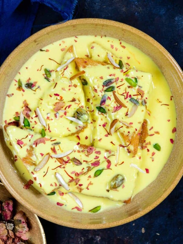 Shahi Tukda (Shahi Toast) is a Mughlai dessert made using deep-fried bread slices, reduced saffron flavored milk (rabdi), and sugar syrup. It is a perfect dessert for festivals and special occasions (vegetarian).