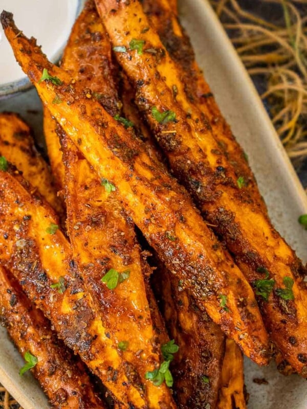 Crispy outside, creamy inside, and lightly spiced, these oven-roasted sweet potato wedges make for a healthy appetizer, snack, or side dish (vegan, gluten-free).