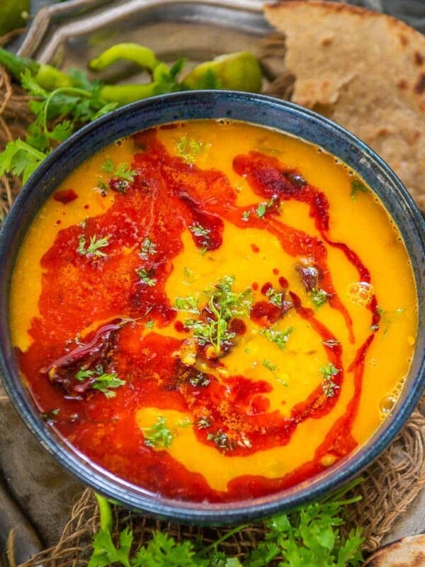 Make this delicious Restaurant-Style Yellow Dal Tadka at home in under 30 minutes using simple ingredients. This popular Indian recipe can be made in an instant pot or a traditional stovetop pressure cooker (vegetarian, can be easily made vegan and gluten-free).