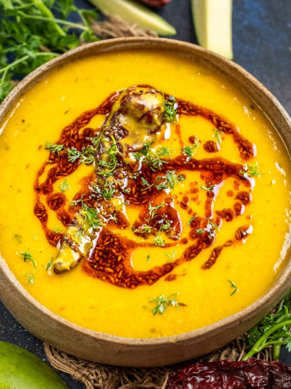 This Raw Mango Dal is a delicious North Indian-style lentil dish made using green raw mangoes, lentils, and a few spices. It is made especially in summer when mangoes are in season. Serve it with rice or chapati for a hearty meal (vegetarian).