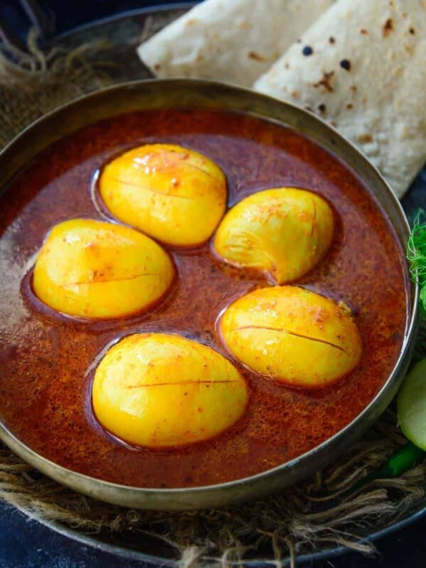 Kolhapuri Egg Curry (Anda Rassa) is a spicy egg curry made by cooking boiled eggs in a flavorful onion-coconut-based gravy. Try my traditional recipe to make it.