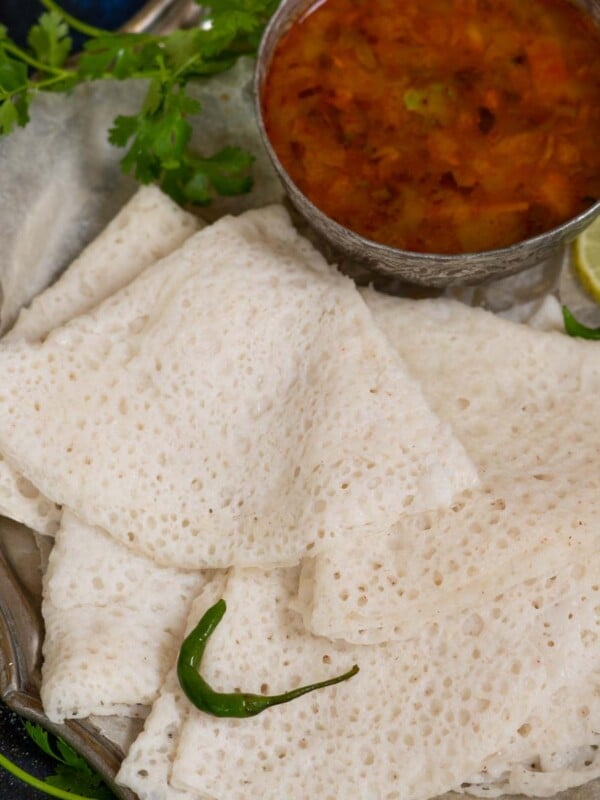 Mangalorean Neer Dosa (Neer Dose, South Indian Breakfast Rice Crepes) are thin, lacy, and soft Indian crepes prepared using rice (vegan, gluten-free).