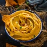 This spicy Roasted Sweet Potato Hummus is a delicious take on the classic hummus recipe. Loaded with roasted sweet potatoes, this creamy, healthy, protein-packed dip is a must-try (vegan, gluten-free, and paleo)