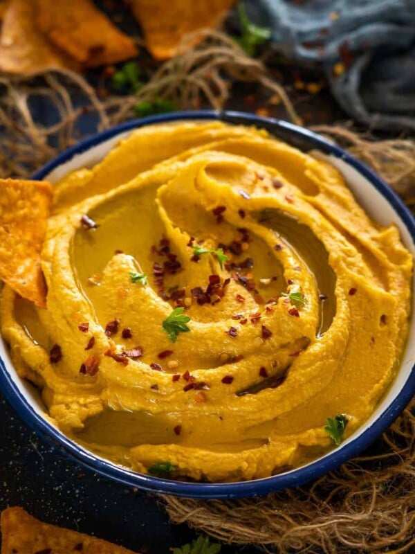 This spicy Roasted Sweet Potato Hummus is a delicious take on the classic hummus recipe. Loaded with roasted sweet potatoes, this creamy, healthy, protein-packed dip is a must-try (vegan, gluten-free, and paleo)