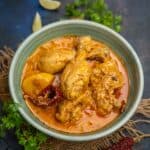 Doi Murgi (Bengali Style Yogurt Chicken Curry) is a simple chicken curry made in every Bengali household. Bone-in chicken is cooked with potatoes in a thin yogurt-based curry. This curry is best served with steamed rice, roti, or luchi (gluten-free).
