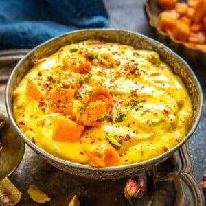 Mango shrikhand, also called Amrakhand is a popular Indian dessert recipe made using yogurt and mango puree. It is a delicious and refreshing variation of the classic shrikhand. Here is how to make it.