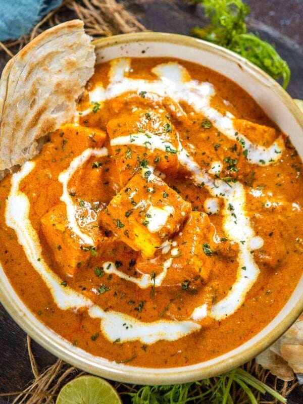 Paneer Butter Masala is a rich and creamy paneer curry where paneer cubes (Indian cottage cheese) are simmered in an onion tomato gravy. It is one of the most popular Indian curries served at restaurants all around the world. Learn to make the best restaurant style paneer butter masala at home using my easy and simple recipe (vegetarian).