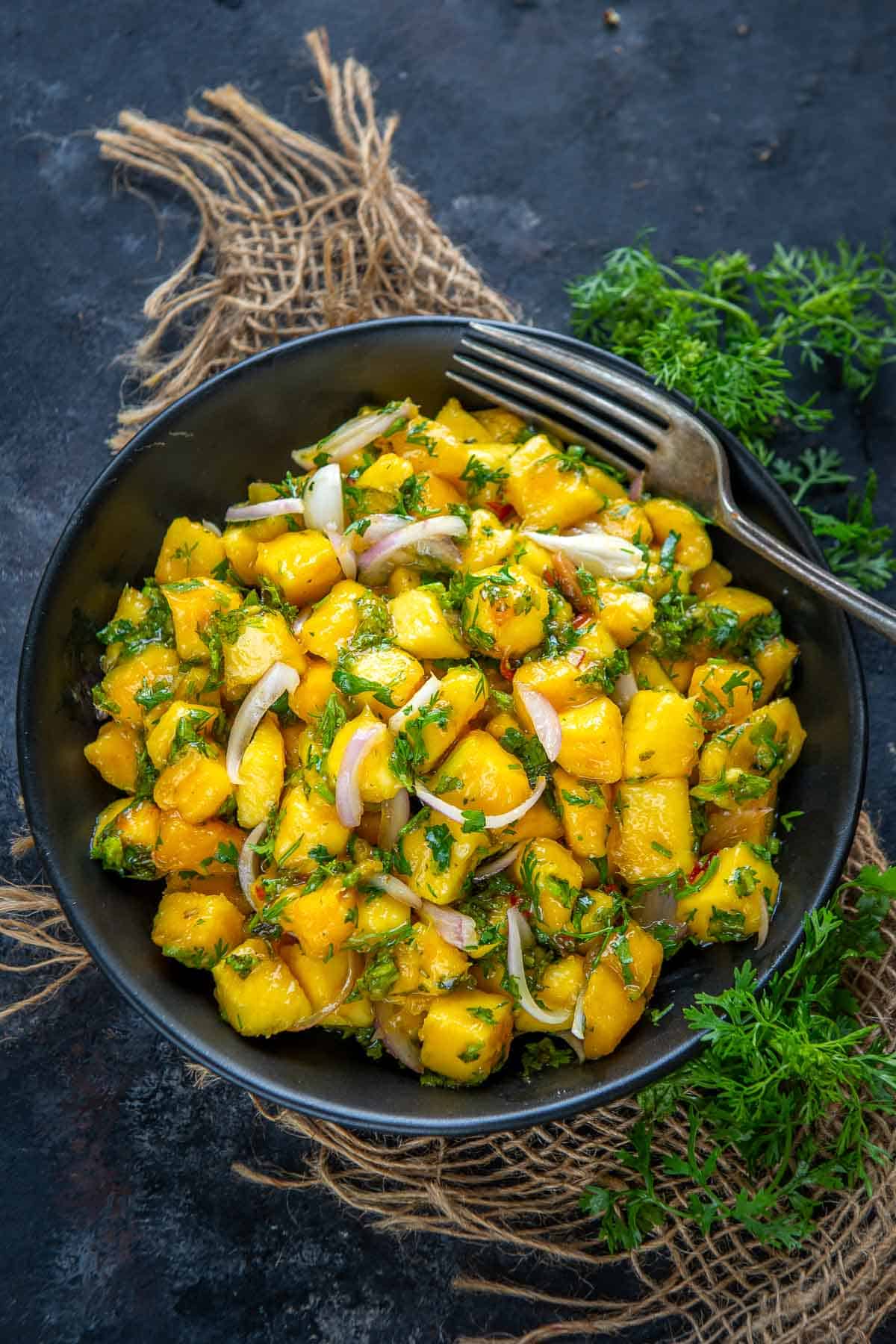 Malaysian mango salad served in a bowl.