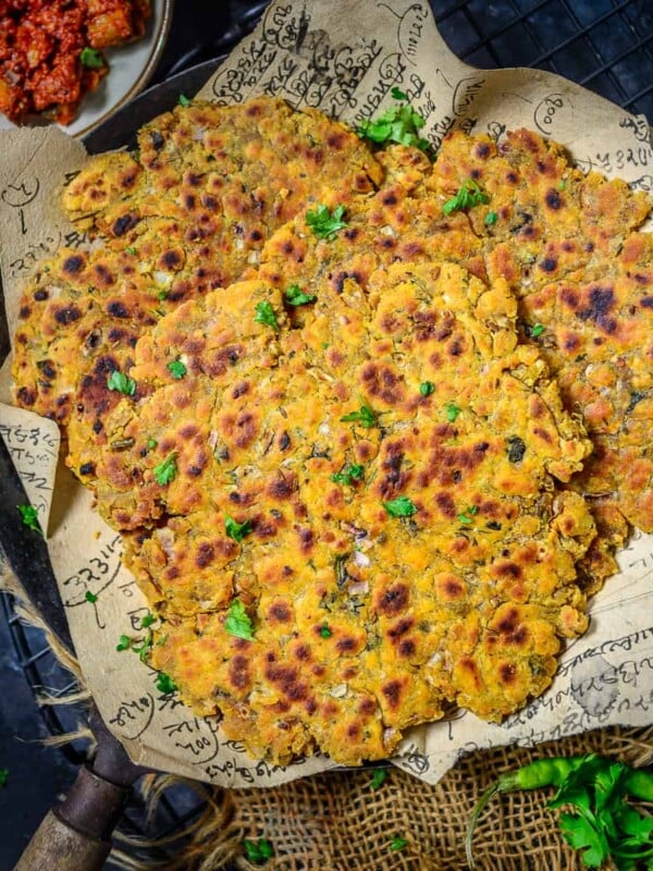A popular dish from Sindhi cuisine, Sindhi Koki is a flatbread with a fabulous taste and interesting texture. It is a breakfast dish made using wheat flour, besan, spices, and herbs (vegan).