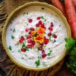 Carrot Raita or Gajar Ka Raita is an Indian accompaniment made using fresh yogurt, grated carrots, and few spices. It can be paired with any Indian meal. Here is how to make it.
