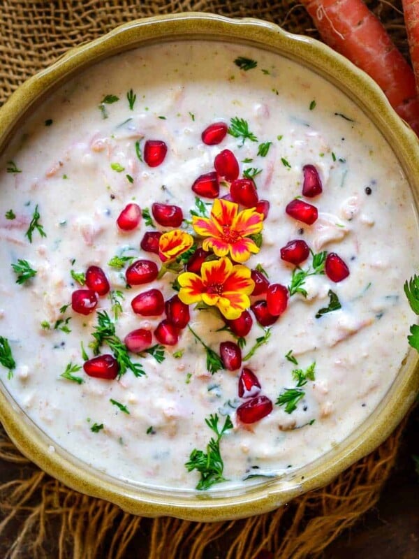 Carrot Raita or Gajar Ka Raita is an Indian accompaniment made using fresh yogurt, grated carrots, and few spices. It can be paired with any Indian meal. Here is how to make it.