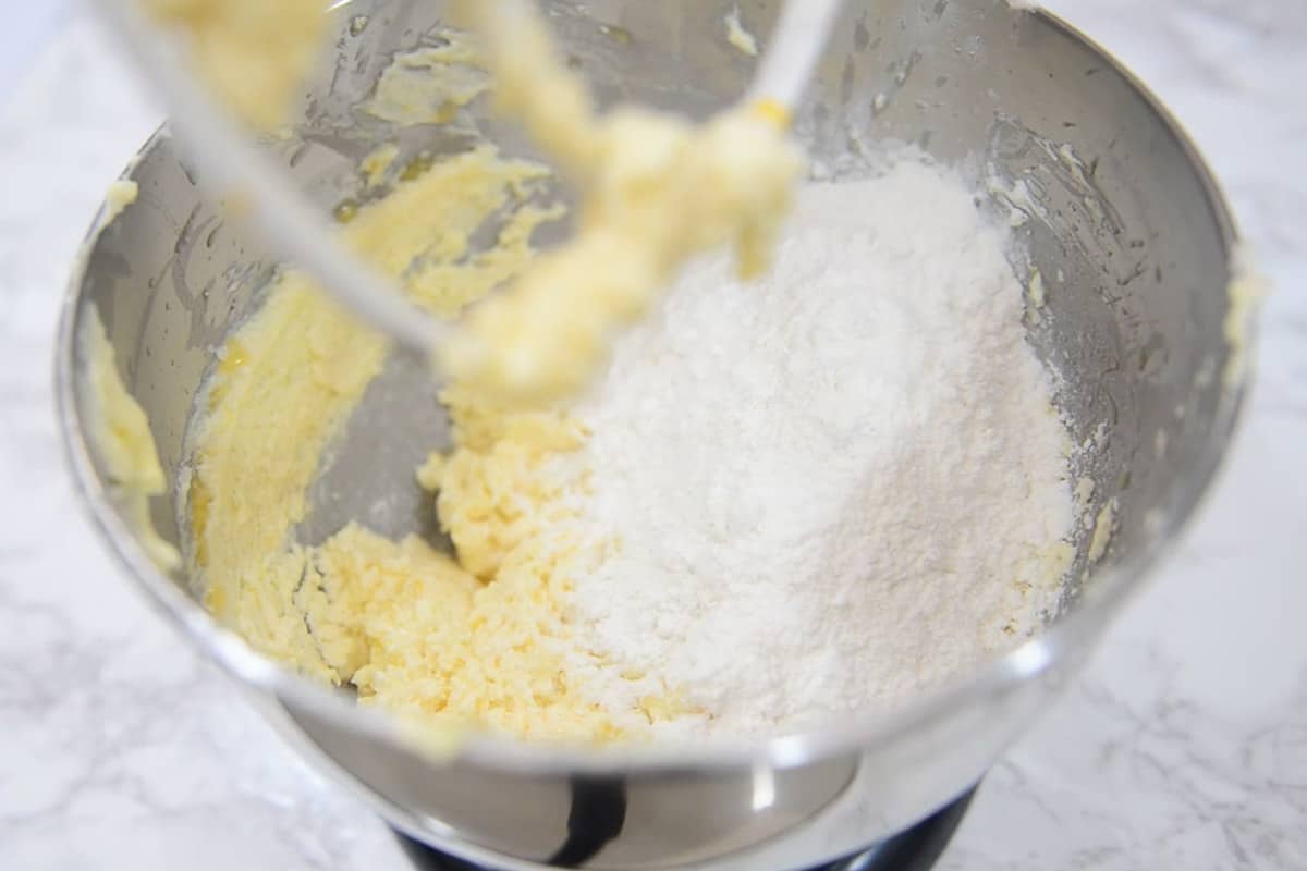 Flour, baking soda and baking powder added in the bowl.