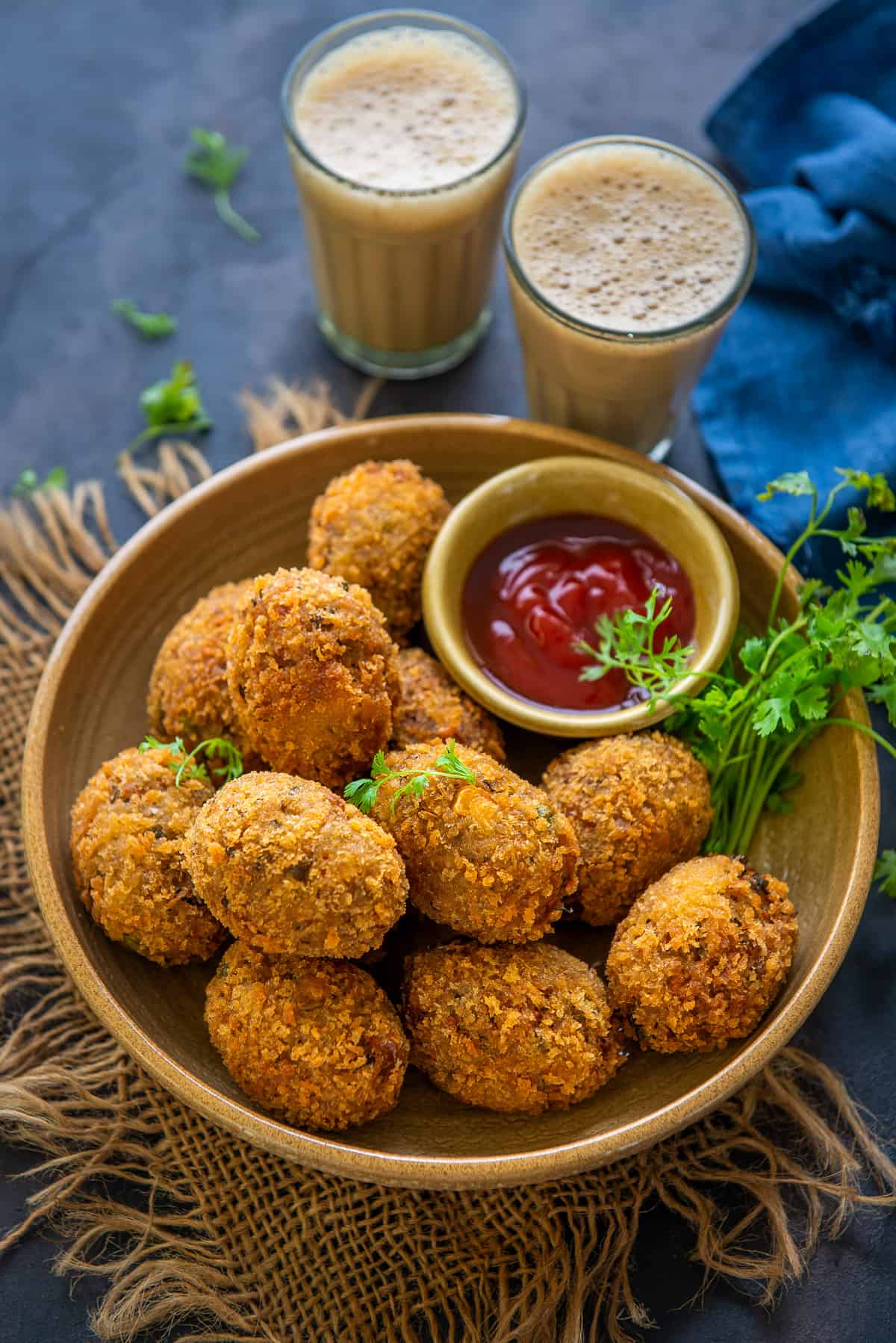 Veg cutlets served on a plate.