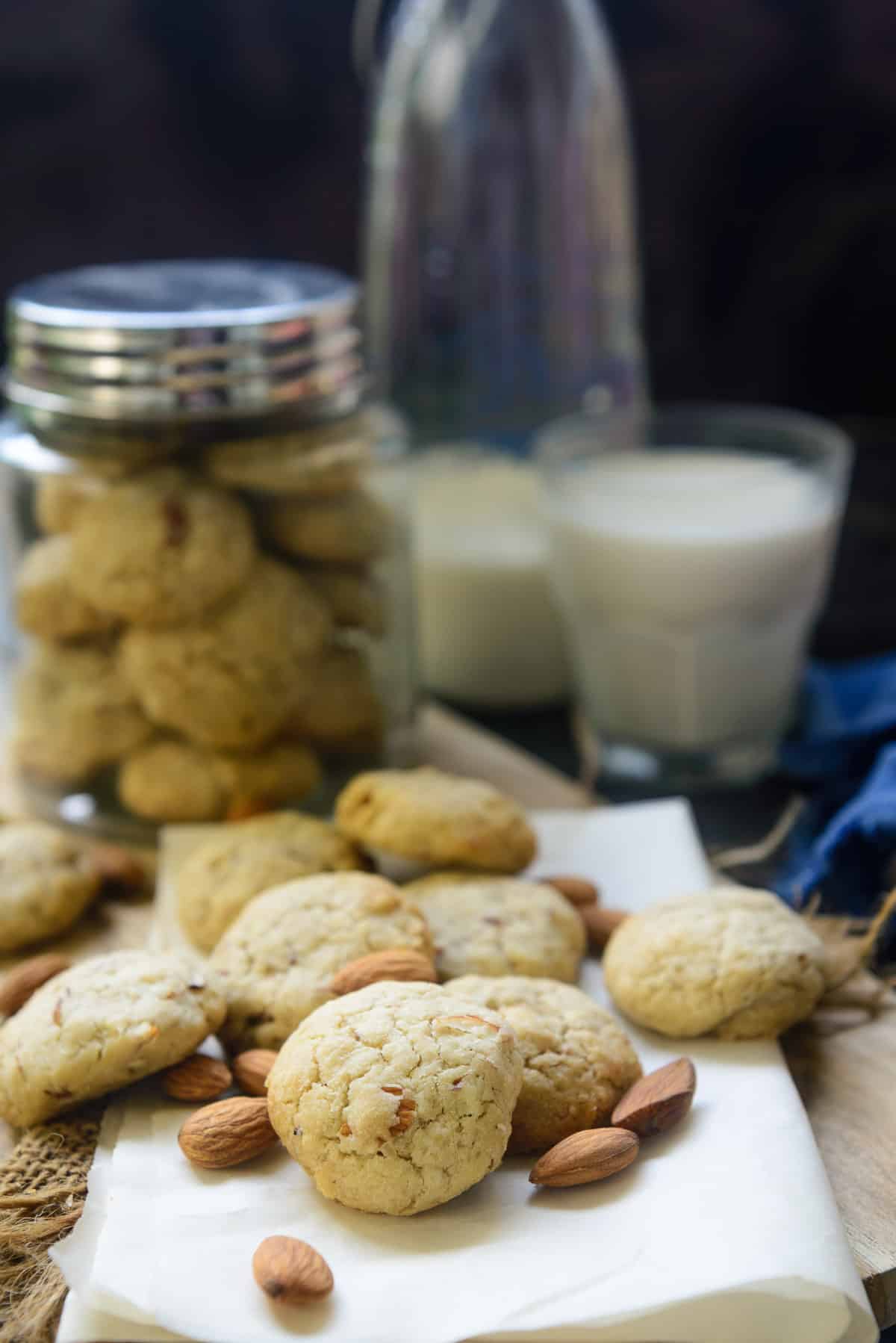 Almond Cookies scattered on a table.