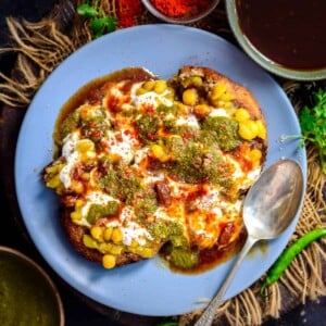 This tangy and spicy Aloo Tikki Chaat is one of the fav chaat dishes, where crispy Aloo Tikkis are topped with a Chickpea Curry and Chutneys. It is a popular street food in India and is loved by many.