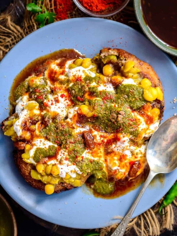 This tangy and spicy Aloo Tikki Chaat is one of the fav chaat dishes, where crispy Aloo Tikkis are topped with a Chickpea Curry and Chutneys. It is a popular street food in India and is loved by many.