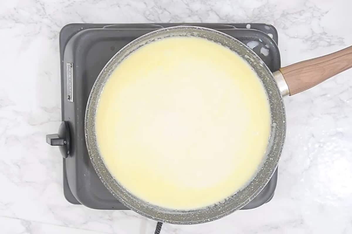 Hot milk added in the pan.