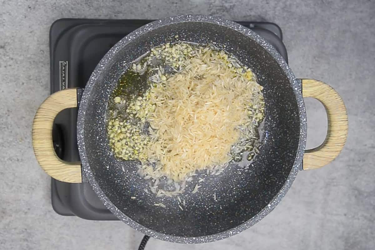 Rice added in the pan.
