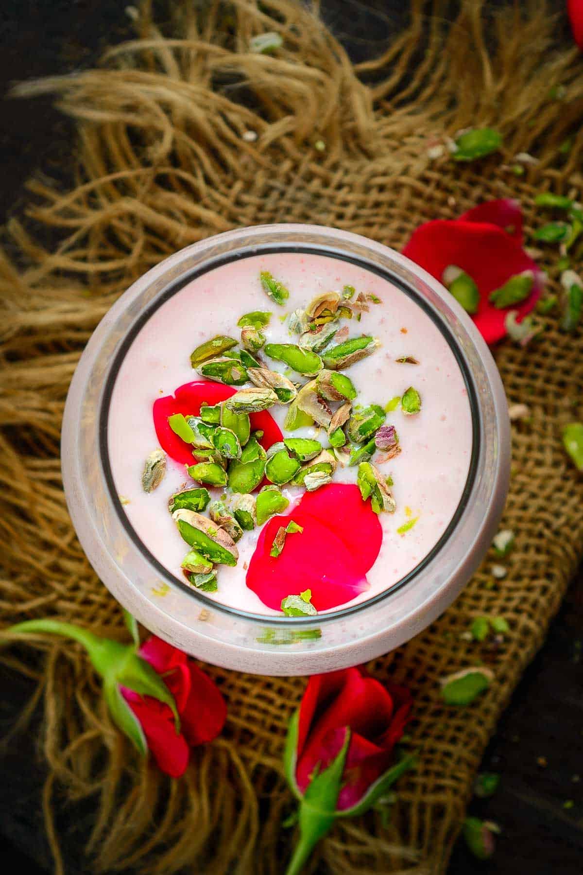 Rose lassi served in a glass.