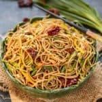 Chilli Garlic Noodles is a simple yet flavourful recipe where noodles are stir fried along with dry red chillies, garlic and lots of vegetables. Try it and it will surely satisfy your taste buds. Here is how to make Chilli Garlic Noodles Recipe.