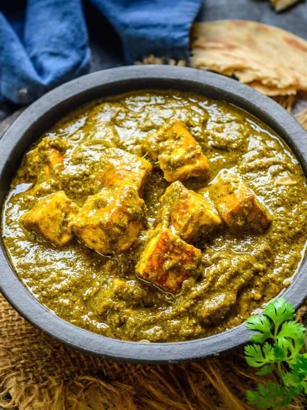 Creamy Saag Paneer is a delicious Indian curry made using a mix of green leafy vegetables and fried cubes of paneer. It is easy to make and goes well with Indian bread like Naan or Paratha. Here is how to make it.