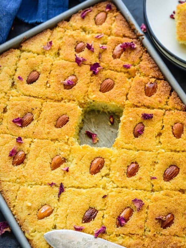 Basbousa (Basboosa) is a Middle Eastern dessert that is basically sweet semolina and coconut cake. It is also called revani or namoura in some parts. Here is how to make it at home.
