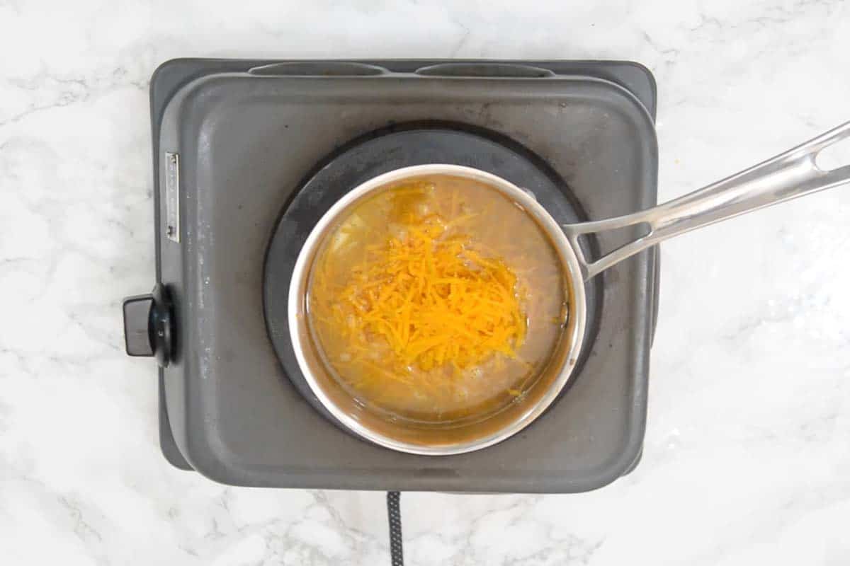 Grated pumpkin added in the pan.