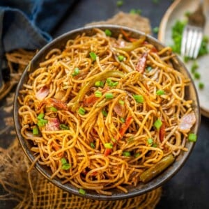 Hakka Noodles are easy and delicious wok-tossed noodles. Thin noodles are tossed with veggies and sauces on high flame to make this Indo Chinese delicacy. Serve it with Veg Manchurian or Paneer Chilli and you are sorted. Here is how to make it.