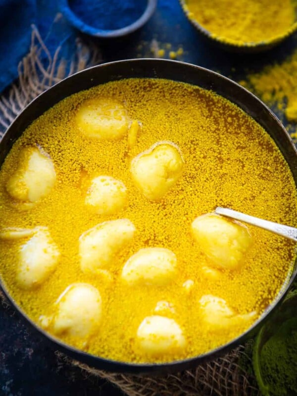 Kanji Vada is a traditional Rajasthani dish where lentil fritters are added in a mustard fermented water. It is a must make for the Holi festival. Here is how to make it.