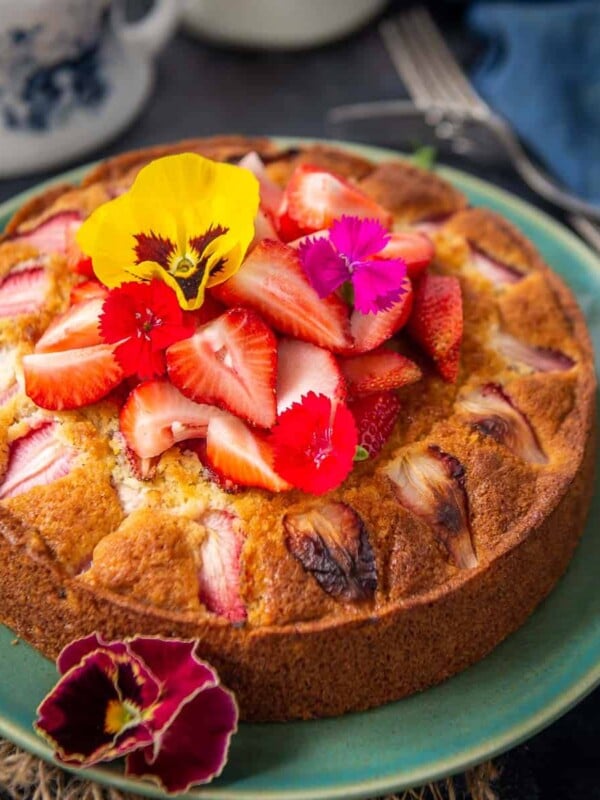 This old fashioned Strawberry Cake is a moist cake that is very simple to make. It has great crumbs and a slight tang from the fresh strawberries. Here is how to make it from scratch.