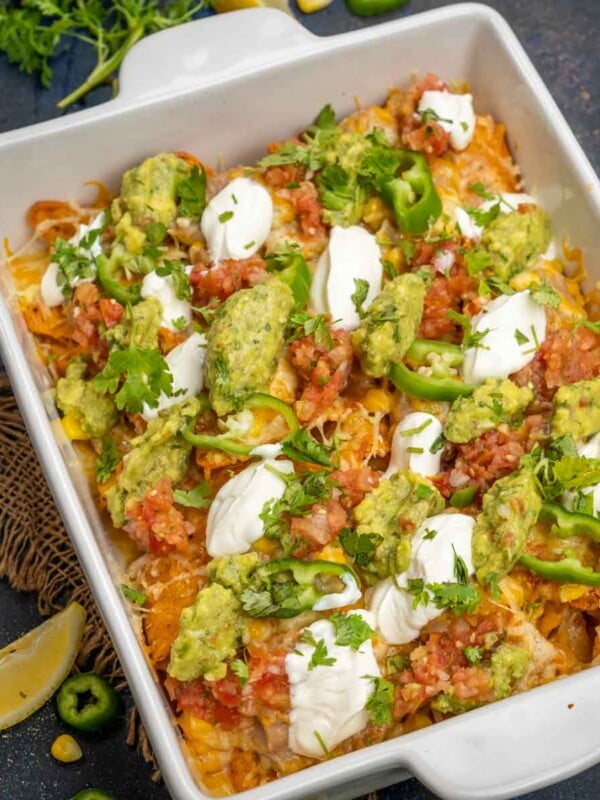 These Vegetarian Loaded Nachos are a great party appetizer, and they come together in no time if you have the ingredients ready. Make these for house parties, game nights, or BBQs.
