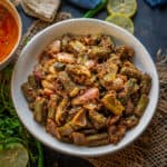 Rajasthani Besan Bhindi is a dry side dish of okra cooked with chickpea flour and spices. This North Indian besan wali bhindi is easy to make and tastes delicious. Here is how to make it.