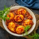 Kerala Style Egg Curry (Mutta Curry) is a spicy egg curry made in almost all Keralan homes. It can be made with or without coconut milk. Serve it with appam or rice for a hearty meal (gluten-free).
