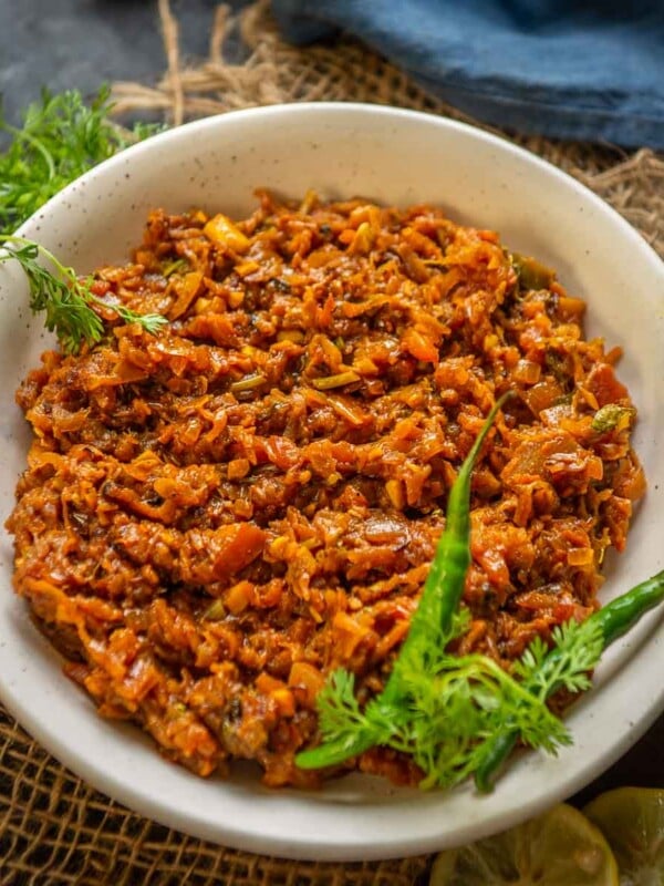 Lauki Ka Bharta is a delicious Indian curry prepared using bottle gourd, onions, tomatoes, ginger, garlic, and spices. Make it using my easy recipe (vegan, can be easily made gluten-free).