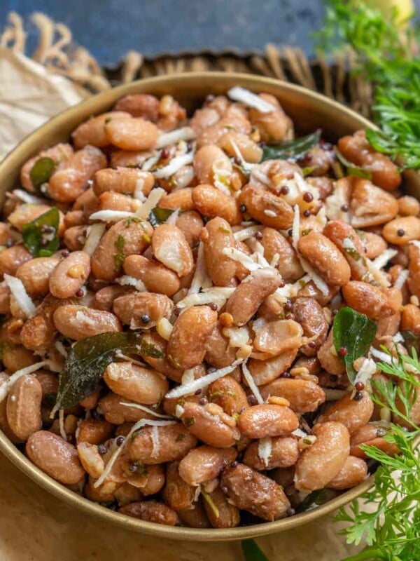 Rajma Sundal is a South Indian dish where cooked red kidney beans are stir-fried in a simple tempering and mixed with grated fresh coconut. Make it using my easy recipe (vegan, can be made gluten-free).