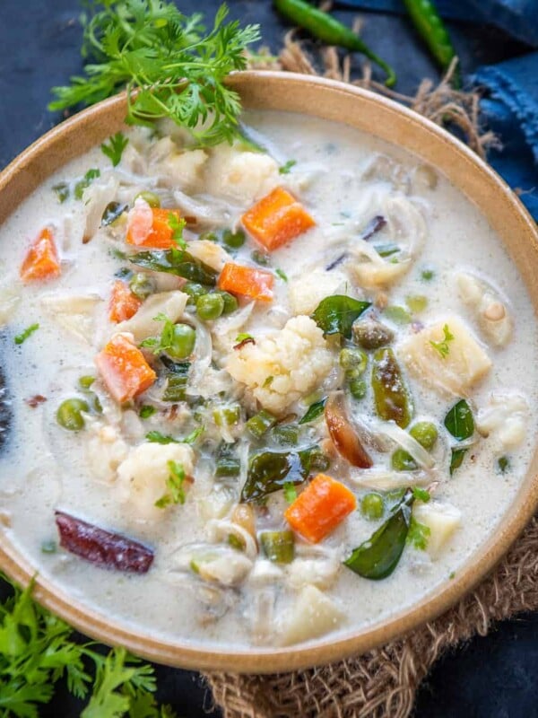 Vegetable Stew is a Kerala Style veg curry where veggies are cooked in coconut milk and very mild spices. It goes great with appam and rice. Here is how to make it.