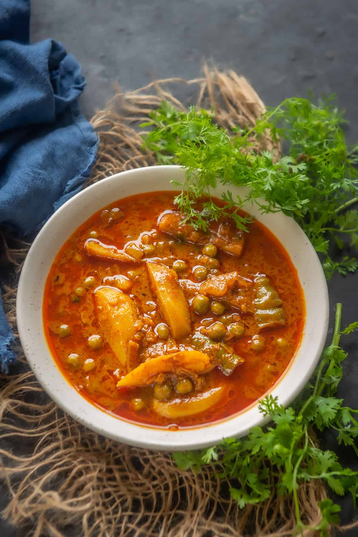 Aloo Matar Curry served in a bowl.