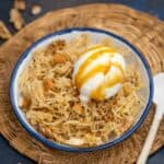Darsaan (Chinese Honey Noodles w/ Vanilla Ice Cream) is a delicious dessert where noodles are fried until crisp and then coated in a honey sauce. These are served with vanilla ice cream for an indulgent treat.
