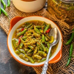 Spicy, tangy, and loaded with flavor, Green Chilli Pickle (Hari Mirch ka Achar) is a delicious North Indian style pickle recipe where fresh green chilies are pickled with mustard seeds and lime juice. Here is my mother's recipe (vegan, gluten-free).